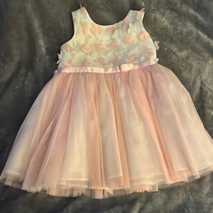 Beautiful pink dress with flowers on top. Perfect for Easter. Size 2T.